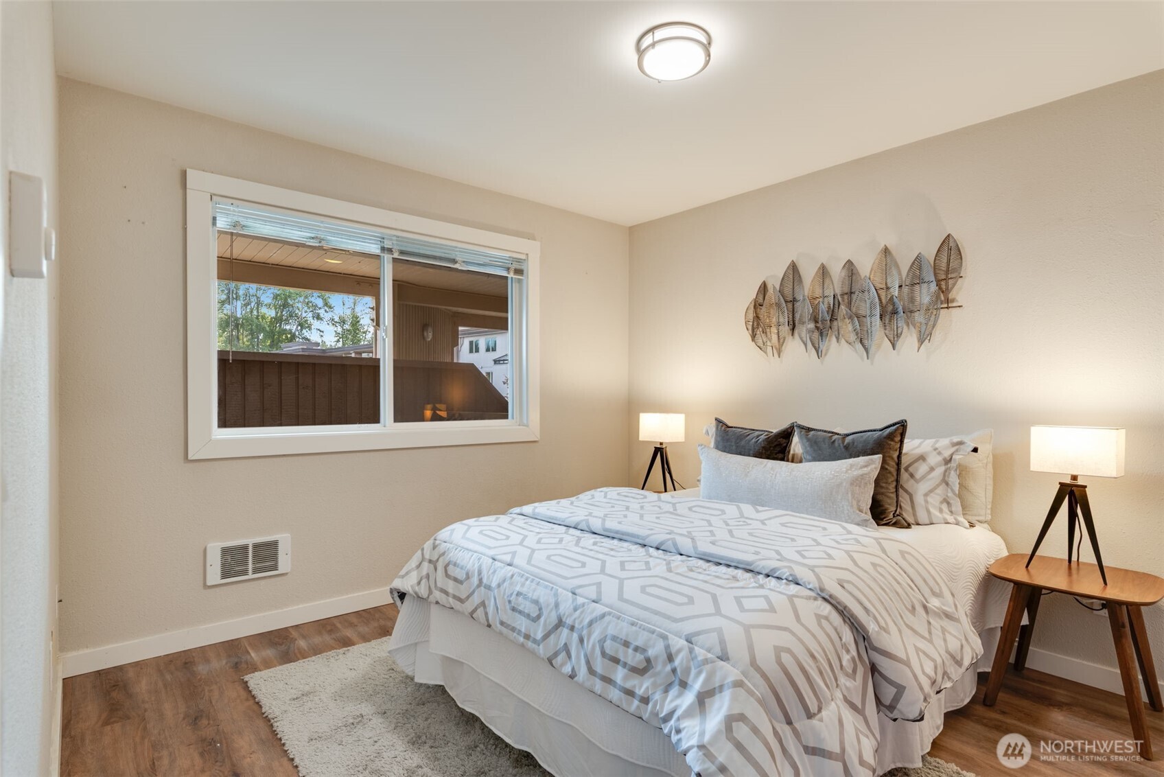 9715 Northeast Juanita Drive, Unit 206B Kirkland, WA 98034 - Photo 23 of 39 a bedroom with a bed and a window