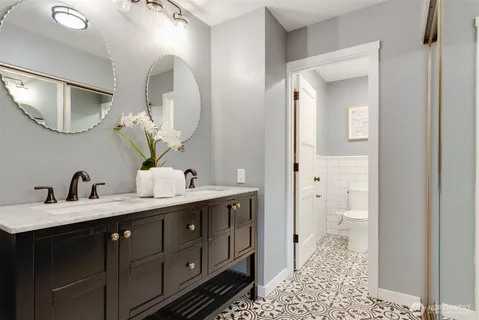 a balcony with chairs and wooden floor