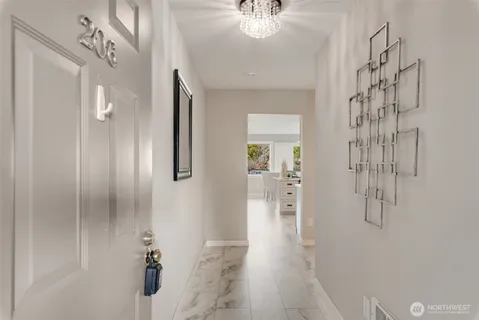 a kitchen with stainless steel appliances a stove a sink and a refrigerator