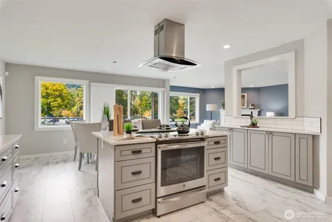 a kitchen with stainless steel appliances a sink stove and refrigerator