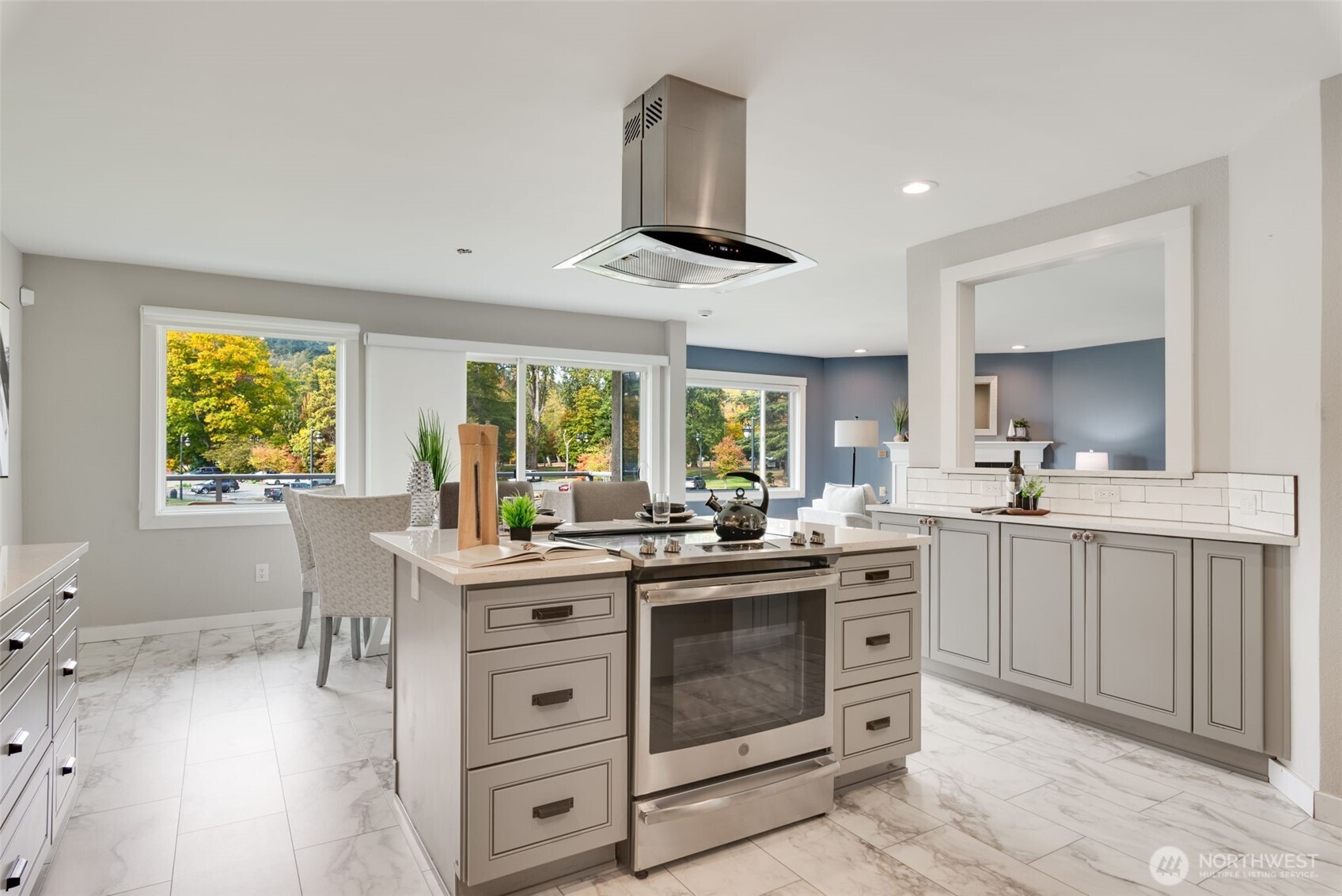 9715 Northeast Juanita Drive, Unit 206B Kirkland, WA 98034 - Photo 7 of 39 a kitchen with stainless steel appliances a stove a sink and a refrigerator
