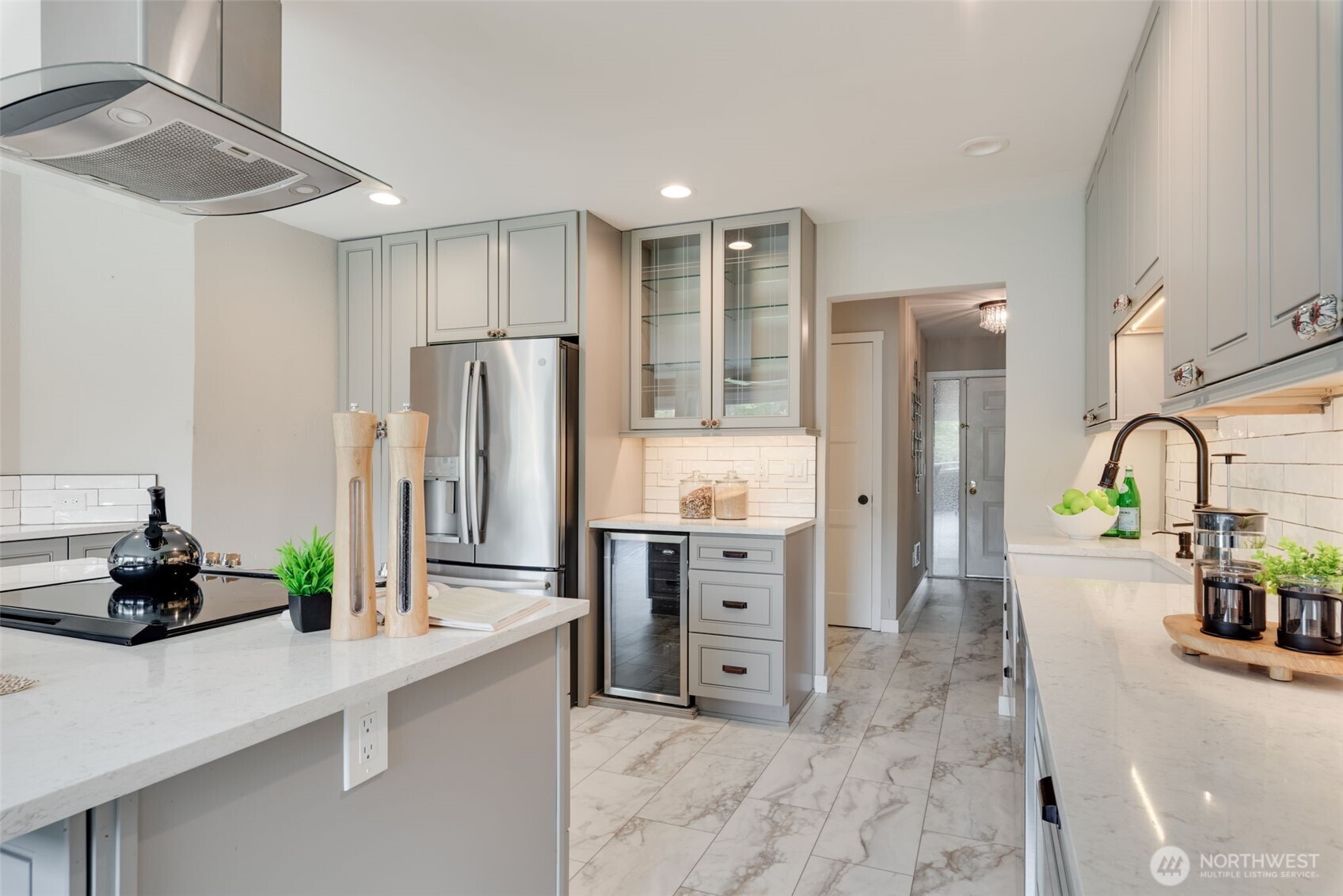 9715 Northeast Juanita Drive, Unit 206B Kirkland, WA 98034 - Photo 8 of 39 a kitchen with stainless steel appliances a refrigerator sink and cabinets