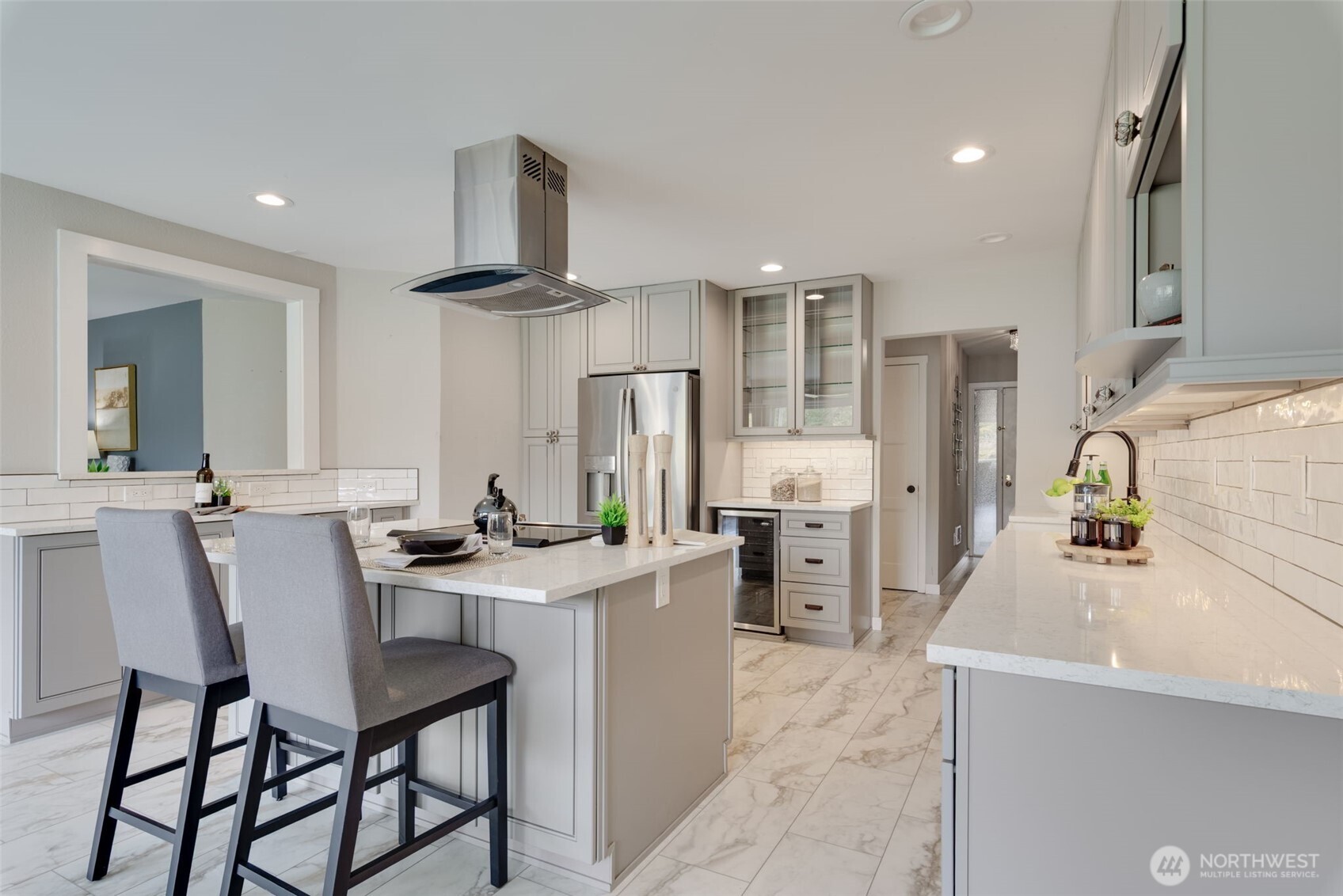 9715 Northeast Juanita Drive, Unit 206B Kirkland, WA 98034 - Photo 9 of 39 a kitchen with stainless steel appliances a sink stove and refrigerator