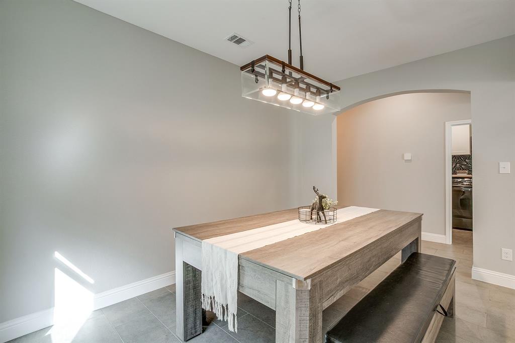 5617 Kilpatrick Avenue Fort Worth, TX 76107 - Photo 12 of 40 a bathroom with a sink a mirror and a shower