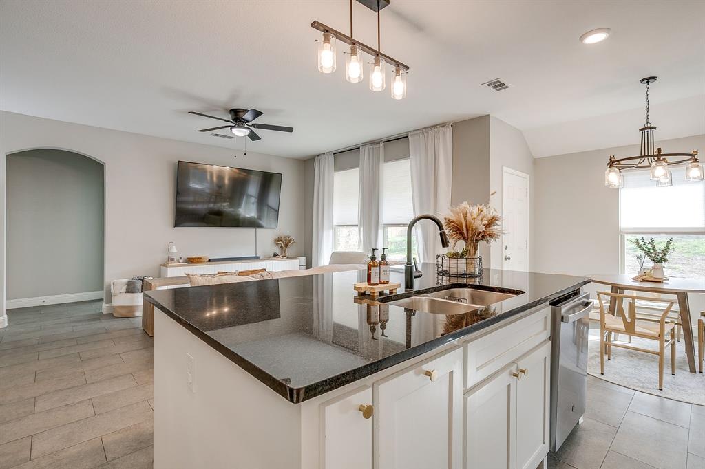 5617 Kilpatrick Avenue Fort Worth, TX 76107 - Photo 17 of 40 a kitchen with kitchen island a sink appliances and a counter top space