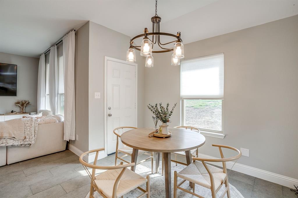 5617 Kilpatrick Avenue Fort Worth, TX 76107 - Photo 18 of 40 a view of a dining room with furniture and window
