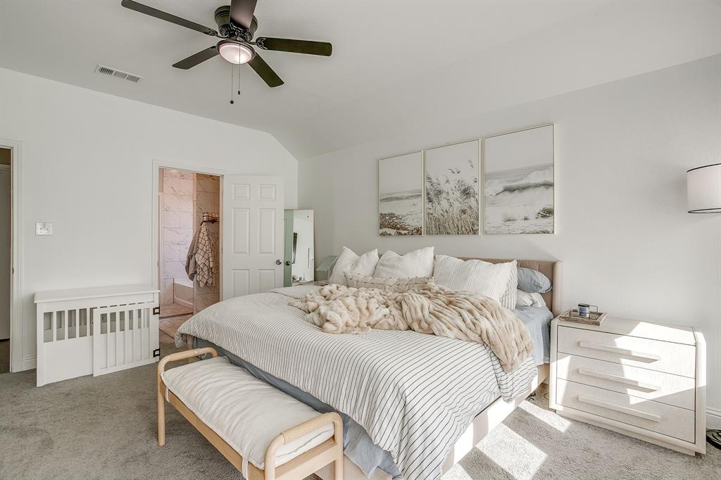 5617 Kilpatrick Avenue Fort Worth, TX 76107 - Photo 23 of 40 a bedroom with a bed and a window