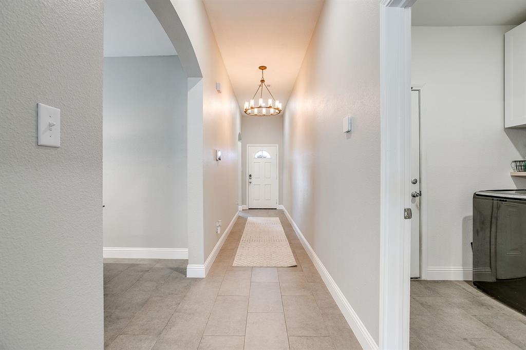 5617 Kilpatrick Avenue Fort Worth, TX 76107 - Photo 3 of 40 a view of a hallway with wooden shelves