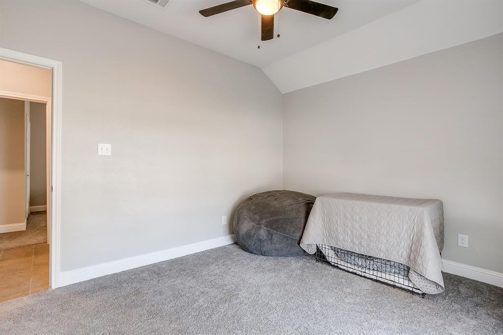 5617 Kilpatrick Avenue Fort Worth, TX 76107 - Photo 34 of 40 a living room with a couch and a ceiling fan