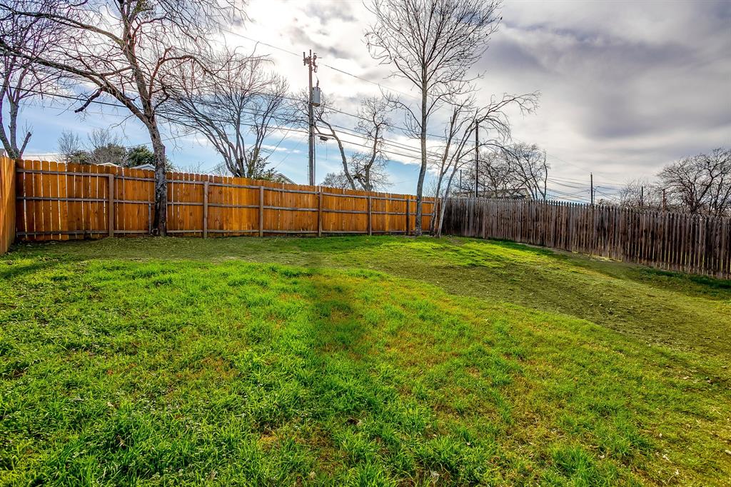 5617 Kilpatrick Avenue Fort Worth, TX 76107 - Photo 39 of 40 a view of a yard with wooden fence