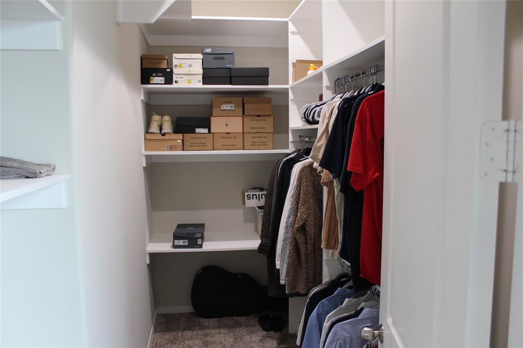 333 Renaissance Lane Heath, TX 75032 - Photo 28 of 35 All the closest have custom closet system featuring multiple shelving units and hanging rods