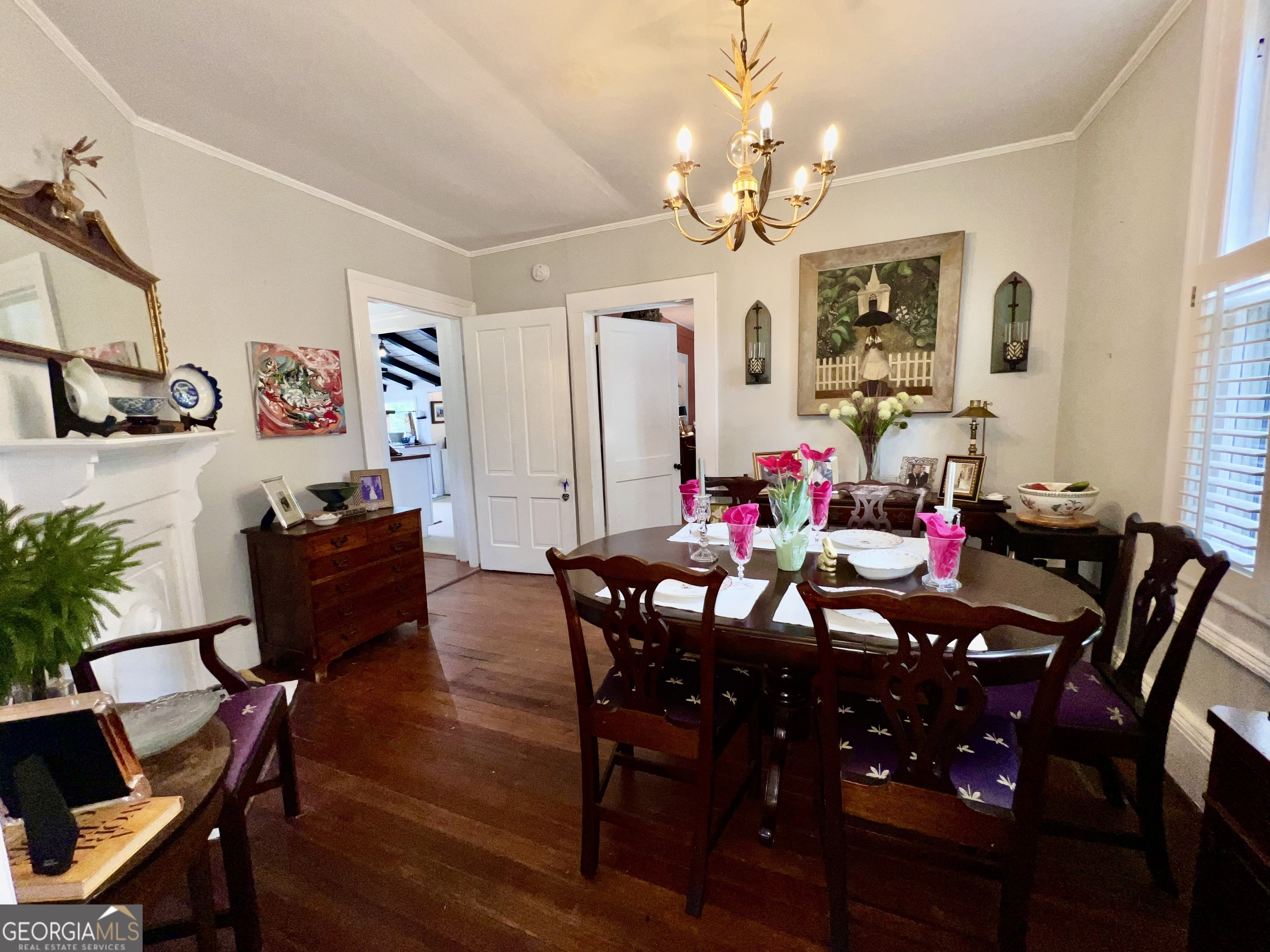 600 Foster Street Madison, GA 30650 - Photo 10 of 54 a view of a dining room with furniture and chandelier