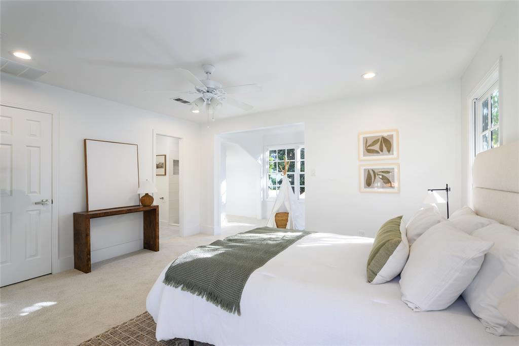 6021 Northwood Road Dallas, TX 75225 - Photo 18 of 40 a spacious bedroom with a bed and furniture