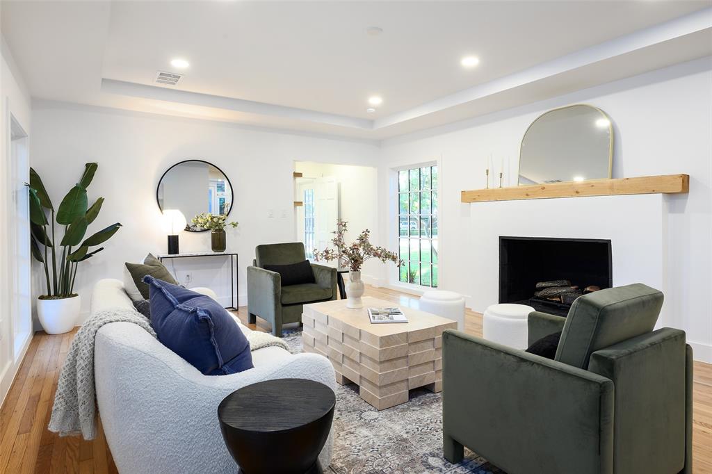 6021 Northwood Road Dallas, TX 75225 - Photo 22 of 40 a living room with furniture potted plant and a fireplace