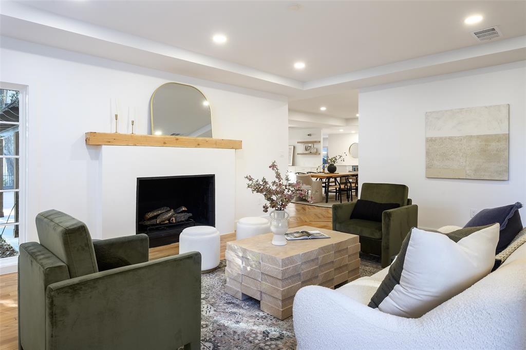 6021 Northwood Road Dallas, TX 75225 - Photo 23 of 40 a living room with furniture and a fireplace