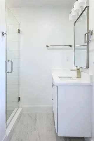 a bathroom with a sink and a shower
