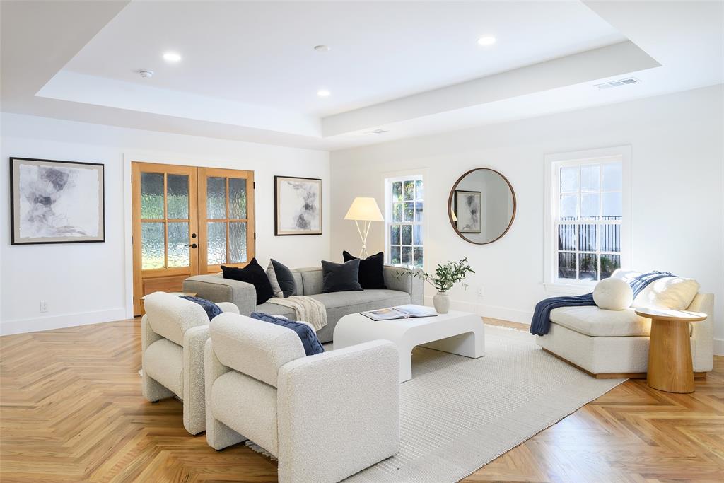 6021 Northwood Road Dallas, TX 75225 - Photo 5 of 40 a living room with furniture a clock and a window