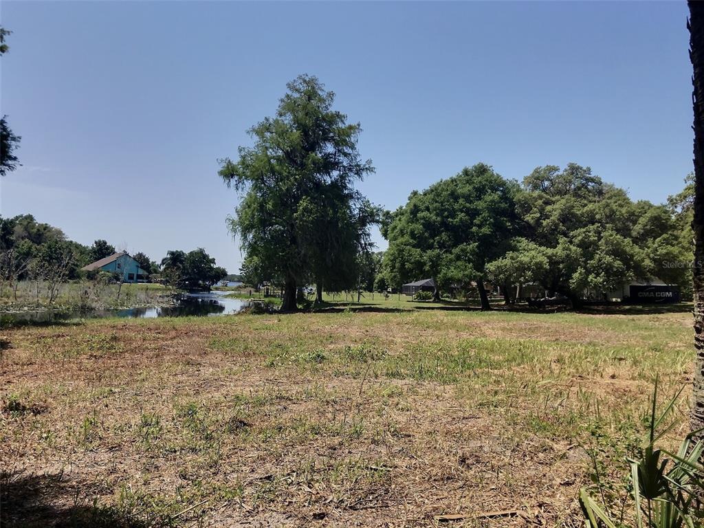 0 Southeast 110th Street Road Belleview, FL 34420 - Photo 5 of 9 a view of a yard with a house