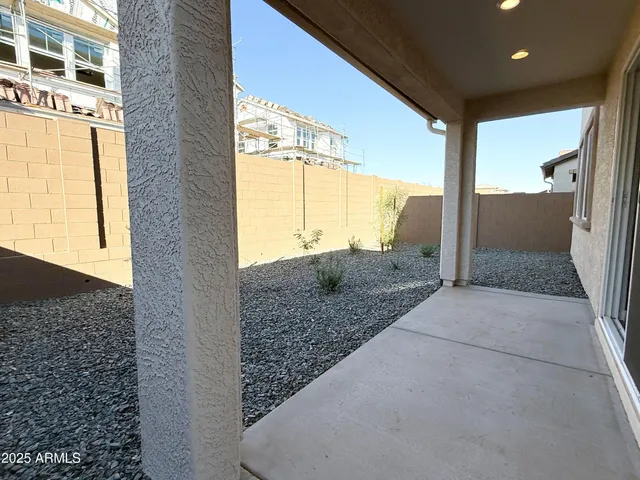 a view of a backyard of the house