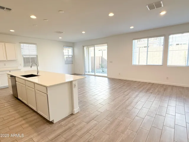 a kitchen with wooden cabinets and white appliances