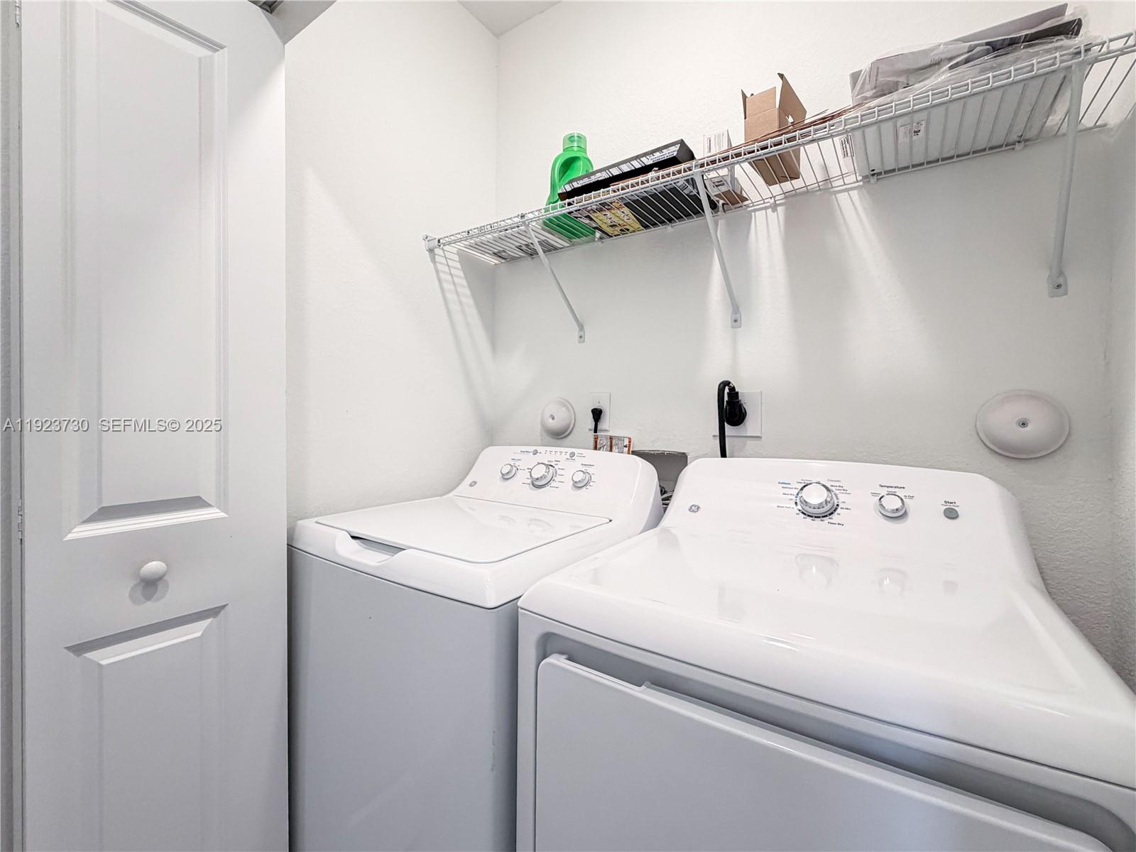 11962 Southwest 247th Terrace, Unit 11962 Homestead, FL 33032 - Photo 28 of 31 a utility room with dryer and washer