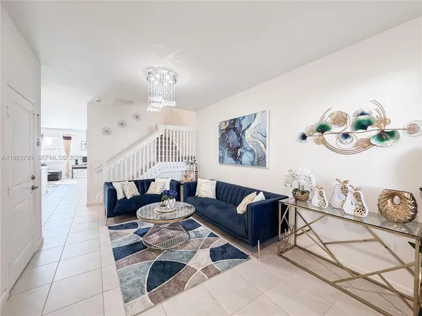 a kitchen with a refrigerator a stove a microwave and cabinets