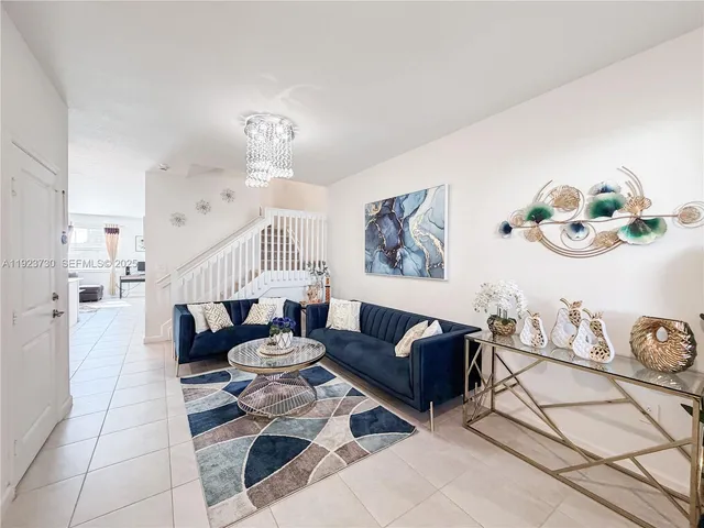 a kitchen with a refrigerator a stove a microwave and cabinets