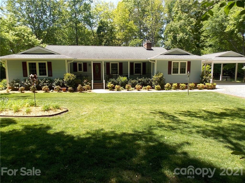 1766 Williams Road Fort Mill, SC 29715 - Photo 1 of 32 a front view of a house with swimming pool having outdoor seating