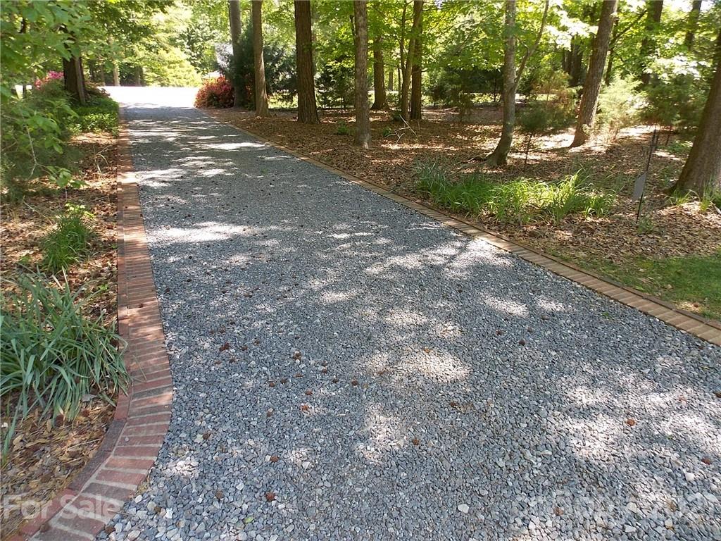 1766 Williams Road Fort Mill, SC 29715 - Photo 2 of 32 a view of a yard with plants and trees