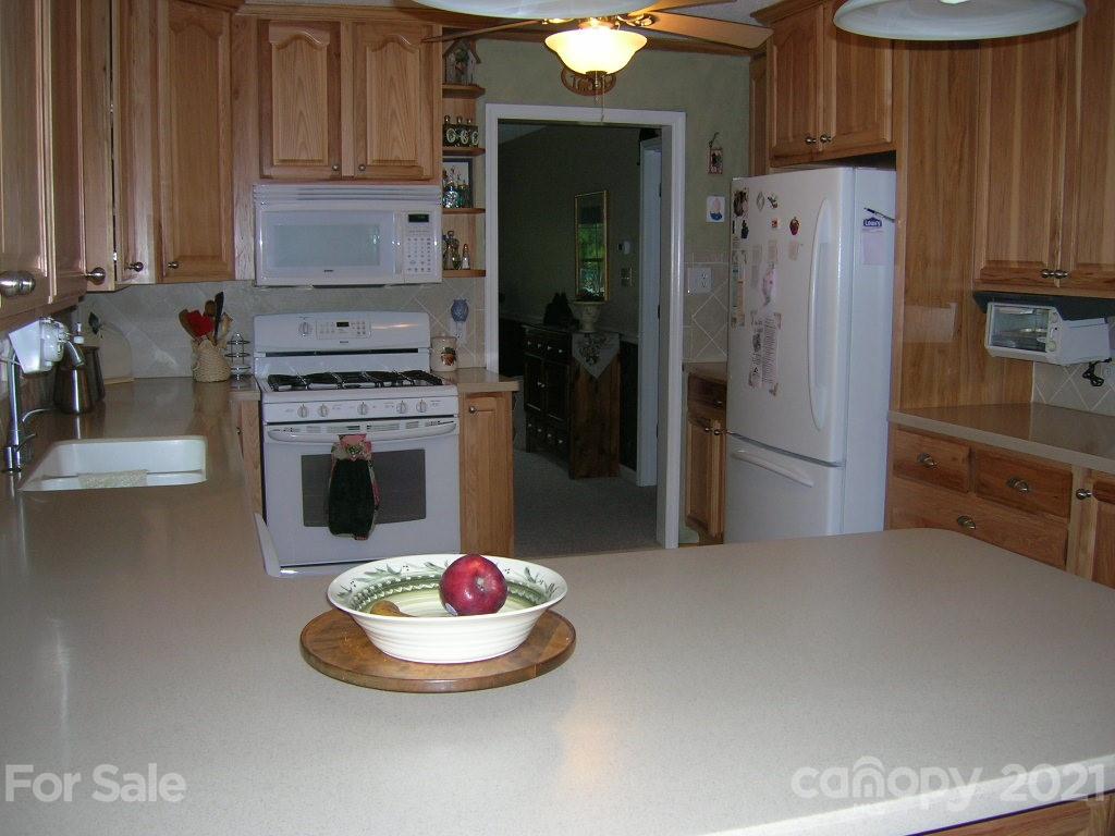 1766 Williams Road Fort Mill, SC 29715 - Photo 16 of 32 a kitchen with a refrigerator and a stove