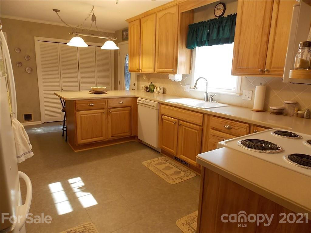 1766 Williams Road Fort Mill, SC 29715 - Photo 18 of 32 a kitchen that has a sink a stove and a microwave