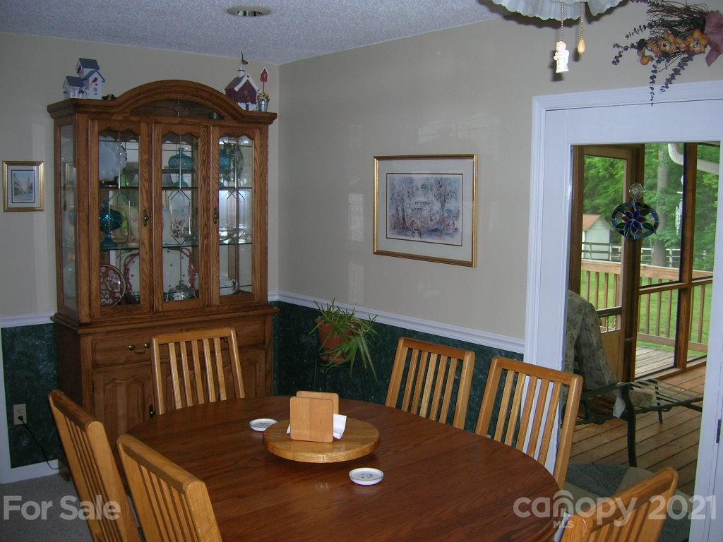 1766 Williams Road Fort Mill, SC 29715 - Photo 19 of 32 a view of a dining room with furniture window and wooden floor