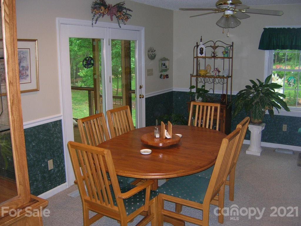 1766 Williams Road Fort Mill, SC 29715 - Photo 20 of 32 a view of a dining room with furniture window and wooden floor