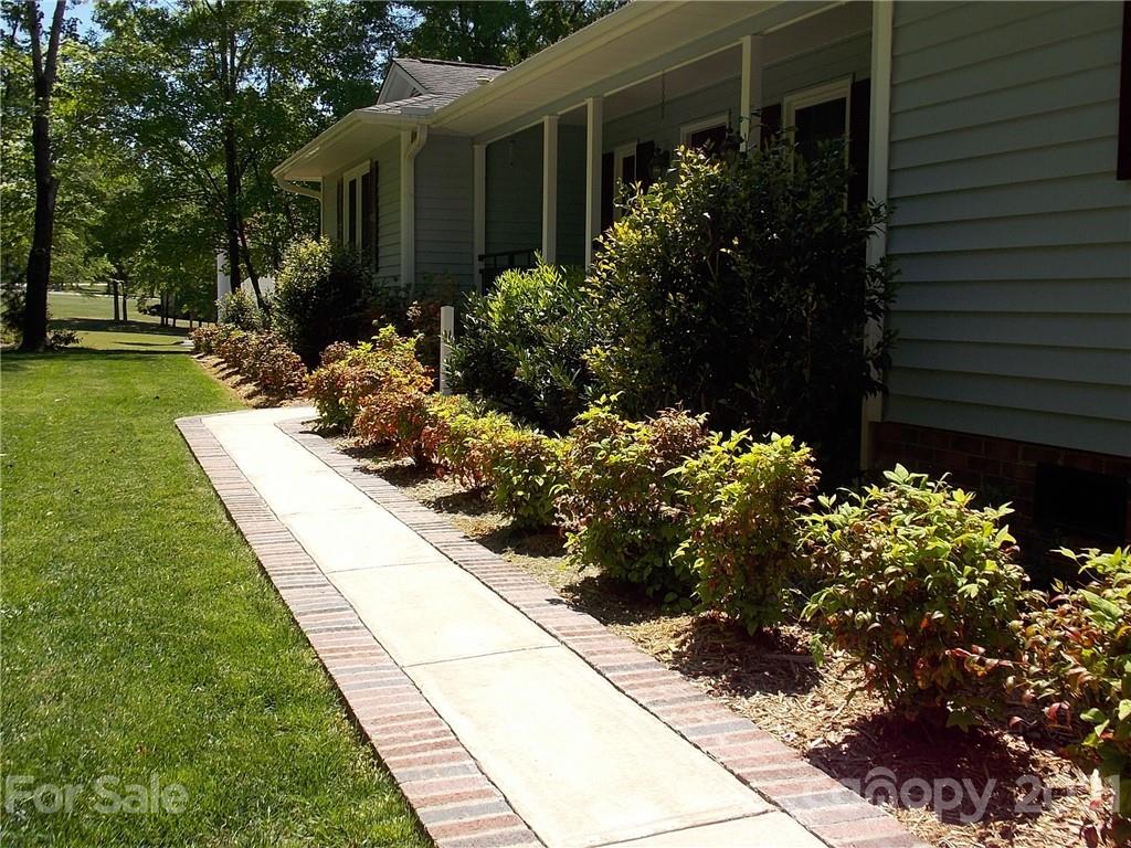 1766 Williams Road Fort Mill, SC 29715 - Photo 3 of 32 a view of a backyard with flower garden