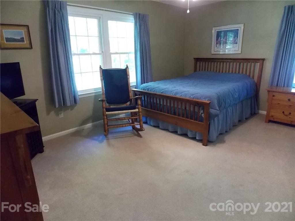 1766 Williams Road Fort Mill, SC 29715 - Photo 21 of 32 a bedroom with a bed chair and window