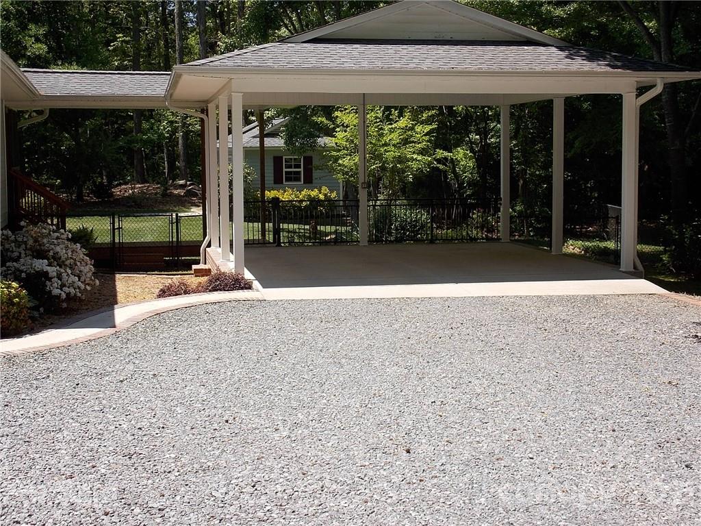 1766 Williams Road Fort Mill, SC 29715 - Photo 6 of 32 a patio with a table and chairs under an umbrella