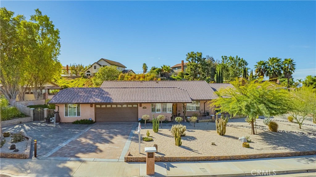 Welcome home to your Canyon Crest stunning totally remodeled single-story home with Solar and RV parking. Gorgeous new front yard landscaping on a driop systme with pavers and stamped concrete driveway.