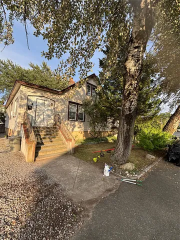 a view of a street with a tree
