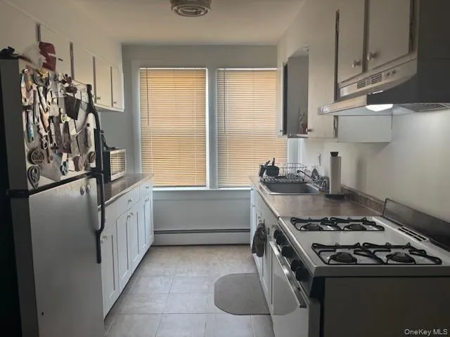 a kitchen with a stove and a refrigerator