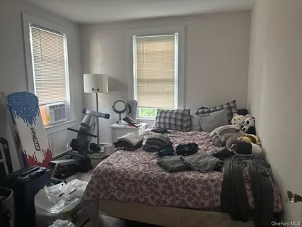 a bed room with a bed and a chair