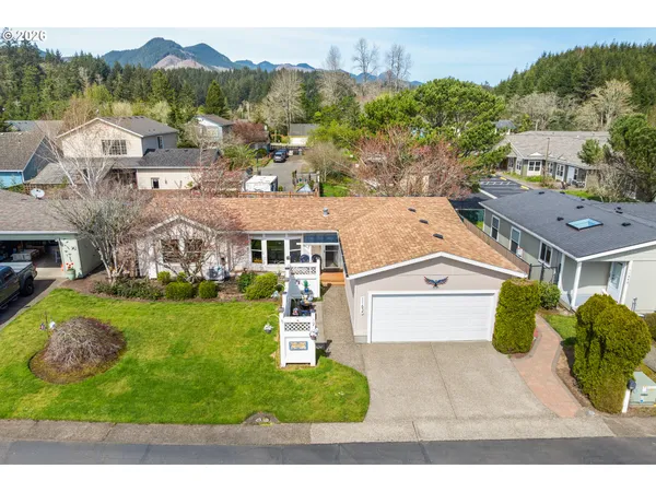 an aerial view of houses with outdoor space