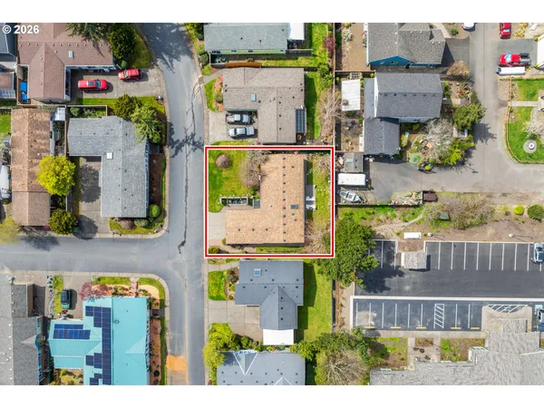 an aerial view of residential houses with outdoor space