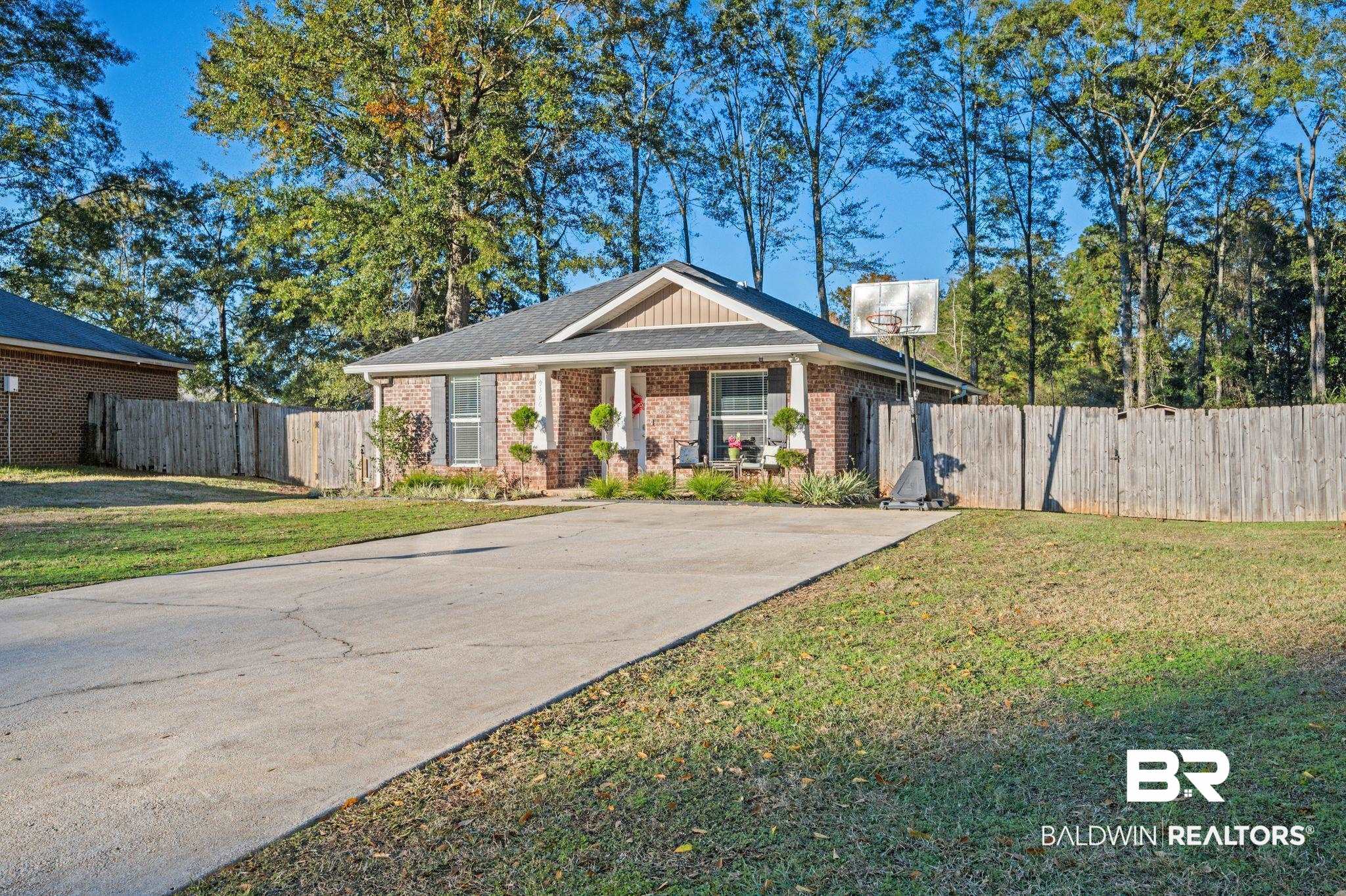 9366 Fox Run Court Semmes, AL 36575 - Photo 2 of 29 View of front facade with a front yard