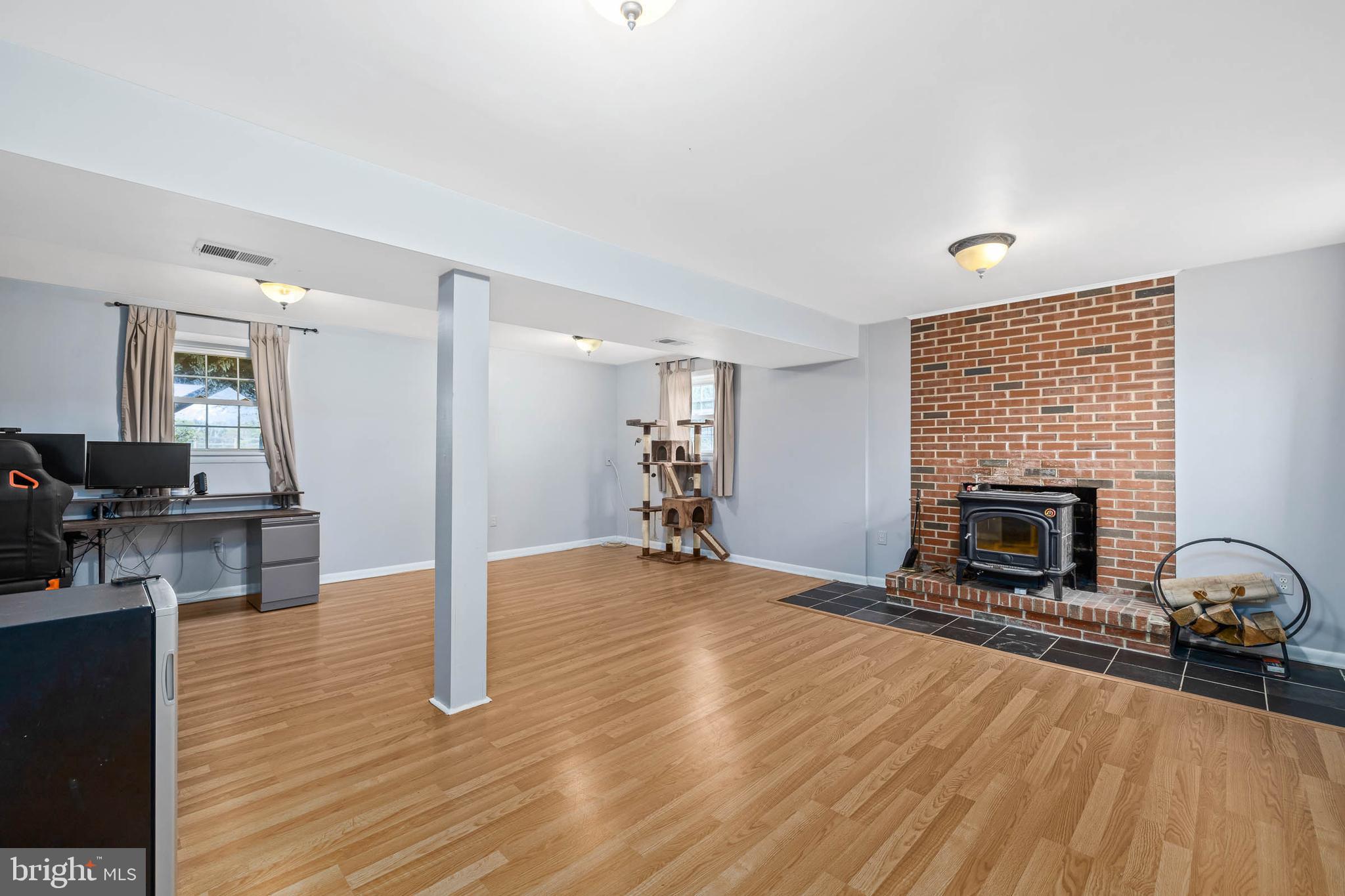 15017 Rolling Ridge Road Haymarket, VA 20169 - Photo 40 of 46 Partially finished basement with wood stove