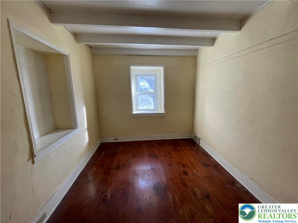 7007 Bausch Road New Tripoli, PA 18066 - Photo 12 of 36 an empty room with wooden floor and windows