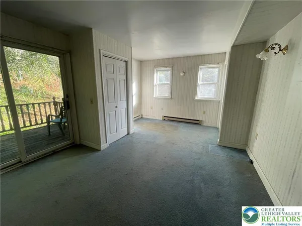 a view of an empty room with a window