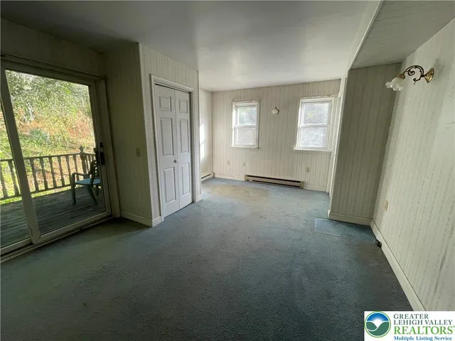 a view of an empty room with a window