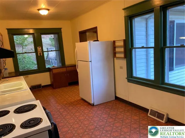 a view of front door and bedroom
