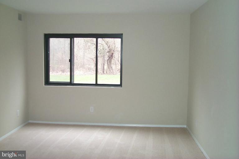 12712 Veirs Mill Road, Unit 843 Rockville, MD 20853 - Photo 2 of 10 an empty room with a window