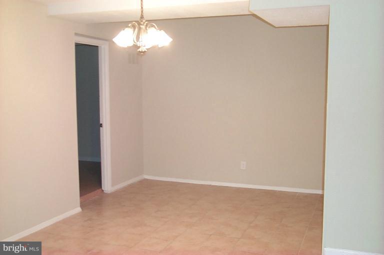 12712 Veirs Mill Road, Unit 843 Rockville, MD 20853 - Photo 7 of 10 a view of empty room with window